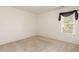 Bedroom featuring carpeted floors, natural light, and neutral colored walls at 1009 Limeberry Ct, Clayton, NC 27520
