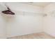 Walk-in closet with white walls, carpeted floor, and wire shelving for storage and organization at 1009 Limeberry Ct, Clayton, NC 27520