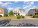 Two-story home featuring an attached garage and a well-maintained front yard at 1009 Limeberry Ct, Clayton, NC 27520
