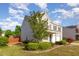 View of the side of a two-story home featuring an attached garage at 1009 Limeberry Ct, Clayton, NC 27520