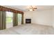 Spacious living room features a fireplace and large windows for natural light at 1009 Limeberry Ct, Clayton, NC 27520