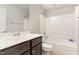 Standard bathroom featuring a vanity sink, mirror, toilet, and shower-tub combo at 101 Lager Ln, Garner, NC 27529