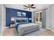 Stylish primary bedroom features a large window, beautiful decor, and an area rug at 101 Lager Ln, Garner, NC 27529