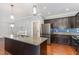 Stylish kitchen featuring an island with seating, stainless steel appliances, and granite countertops at 101 Lager Ln, Garner, NC 27529