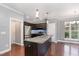 Modern kitchen featuring an island, granite countertops, and stainless steel appliances at 101 Lager Ln, Garner, NC 27529