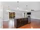 Bright kitchen boasts granite counters, stainless appliances, an island, and a seamless transition to the outdoor deck at 101 Lager Ln, Garner, NC 27529