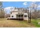 Expansive backyard with a deck and screened porch, offering an outdoor retreat and picturesque views at 101 Redfoot Run Rd, Chapel Hill, NC 27516