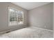 Cozy bedroom featuring neutral carpet and a large window showcasing an outdoor view at 101 Redfoot Run Rd, Chapel Hill, NC 27516