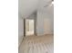 Bright bedroom with neutral carpet and an open doorway, offering a glimpse into another room at 101 Redfoot Run Rd, Chapel Hill, NC 27516