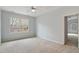 Spacious bedroom with large windows that fill the space with ample natural light and cozy carpeting at 101 Redfoot Run Rd, Chapel Hill, NC 27516