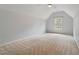 Spacious bedroom featuring neutral carpet, ample natural light, and a modern ceiling fan at 101 Redfoot Run Rd, Chapel Hill, NC 27516