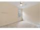 Bedroom featuring a neutral color scheme, soft carpeting, and a window providing plenty of natural light at 101 Redfoot Run Rd, Chapel Hill, NC 27516
