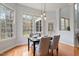 Bright dining room with hardwood floors and large windows offering natural light at 101 Redfoot Run Rd, Chapel Hill, NC 27516