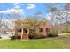 Beautiful brick two-story home with landscaped front yard and inviting entryway at 101 Redfoot Run Rd, Chapel Hill, NC 27516