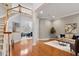 Open foyer with gleaming hardwood floors, staircase, and view of the living spaces at 101 Redfoot Run Rd, Chapel Hill, NC 27516