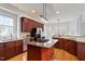 Open-concept kitchen with stainless steel appliances, granite countertops, and a kitchen island at 101 Redfoot Run Rd, Chapel Hill, NC 27516