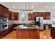 Spacious kitchen with stainless steel appliances, a large island, and plenty of cabinet space at 101 Redfoot Run Rd, Chapel Hill, NC 27516
