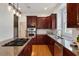 Gourmet kitchen featuring granite countertops, stainless steel appliances, and a gas cooktop island at 101 Redfoot Run Rd, Chapel Hill, NC 27516