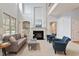 Cozy living area featuring a fireplace, built-in bookshelves, and high ceilings at 101 Redfoot Run Rd, Chapel Hill, NC 27516