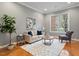 Bright living room featuring hardwood floors, a neutral color palette, and ample natural light at 101 Redfoot Run Rd, Chapel Hill, NC 27516
