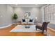 Cozy living room with hardwood floors, neutral walls, and bright natural light at 101 Redfoot Run Rd, Chapel Hill, NC 27516