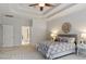 Spacious main bedroom with a tray ceiling, neutral color scheme, and ample natural light at 101 Redfoot Run Rd, Chapel Hill, NC 27516