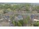 Breathtaking aerial view of the home surrounded by lush greenery, other homes, and a nearby road at 104 Sierra Dr, Chapel Hill, NC 27514