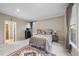 Comfortable bedroom with a decorative bed, soft lighting, and large windows for natural light at 104 Sierra Dr, Chapel Hill, NC 27514