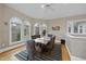 Bright and airy dining room with hardwood floors and a large table at 104 Sierra Dr, Chapel Hill, NC 27514