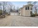 Spacious home featuring a three-car garage, charming architecture, and a basketball court at 104 Sierra Dr, Chapel Hill, NC 27514