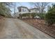 Stately two-story home featuring a unique turret design and meticulously maintained landscaping at 104 Sierra Dr, Chapel Hill, NC 27514