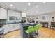 Spacious kitchen featuring an island with barstool seating and modern stainless steel appliances at 104 Sierra Dr, Chapel Hill, NC 27514