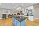 Open concept kitchen with a view into the dining room and living space, featuring an island at 104 Sierra Dr, Chapel Hill, NC 27514