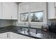 Kitchen sink and countertop area with a large window offering natural light and outdoor views at 104 Sierra Dr, Chapel Hill, NC 27514