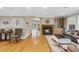 Open-concept living area with hardwood floors, a fireplace, and comfortable seating arrangements at 104 Sierra Dr, Chapel Hill, NC 27514