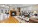 Spacious living room features a cozy fireplace, hardwood floors, and stylish decor at 104 Sierra Dr, Chapel Hill, NC 27514