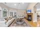 Warm living room featuring hardwood floors, a cozy fireplace, and modern furnishings at 104 Sierra Dr, Chapel Hill, NC 27514