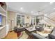 Cozy living room with hardwood floors, neutral walls, and comfortable seating; the perfect space for relaxation and entertainment at 104 Sierra Dr, Chapel Hill, NC 27514