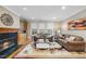 Inviting living room with hardwood floors, fireplace, and large windows, offering a comfortable atmosphere at 104 Sierra Dr, Chapel Hill, NC 27514