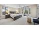 Spacious main bedroom features a large bed, carpeted floors, and large windows at 104 Sierra Dr, Chapel Hill, NC 27514