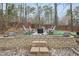 Beautiful backyard patio area features brickwork, lush greenery, and multiple seating options for outdoor enjoyment at 104 Sierra Dr, Chapel Hill, NC 27514