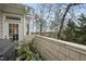 Outdoor patio area with potted plants and a view of lush trees and greenery in the background at 104 Sierra Dr, Chapel Hill, NC 27514