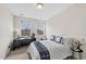 A quaint bedroom with a dedicated desk area, offering natural light and a serene space at 10411 Rosegate Ct # 304, Raleigh, NC 27617