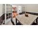 Dining room with adjacent kitchen and hardwood floors at 10411 Rosegate Ct # 304, Raleigh, NC 27617