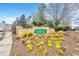 Village at Cascades entrance sign surrounded by colorful flower beds at 10411 Rosegate Ct # 304, Raleigh, NC 27617