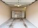 Inside the garage there is an installed storage system and concrete flooring at 10411 Rosegate Ct # 304, Raleigh, NC 27617