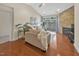 Cozy living room with a stone fireplace, hardwood floors, and sliding glass doors to the outdoor balcony at 10411 Rosegate Ct # 304, Raleigh, NC 27617