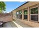 Private back patio with brick privacy fence and secure access gate at 1053 Beechcraft Dr # 124, Mebane, NC 27302