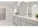 Elegant bathroom featuring dual vanities, marble countertops, and a separate tub and shower offers luxury at 1053 Beechcraft Dr # 124, Mebane, NC 27302