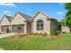 Beautifully landscaped yard and well-maintained front exterior featuring a two-car attached garage at 1053 Beechcraft Dr # 124, Mebane, NC 27302